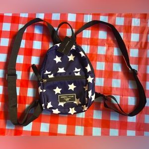 Brand New With Tags: Kendall + Kylie Mini Backpack. Navy Blue with White Stars.